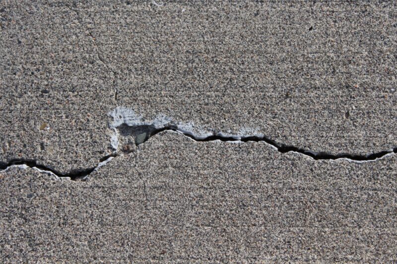 close up of a large crack in a piece of concrete